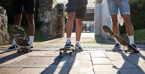 Image showing Shoes, skateboard group and people in street, city or outdoors preparing for practice. Exercise, fitness and skateboarding sports, training and skaters standing together on urban road after workout.