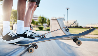 Image showing Skateboarding, skateboards and skatepark drop in for extreme sports exercise friend for dangerous fun, adrenaline rush and learning trick. Modern outdoor activity, healthy athlete and fitness workout