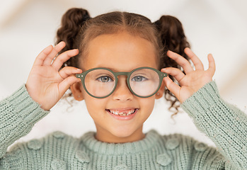 Image showing Vision, eye care and portrait of child with glasses for optical healthcare, eyesight support and test prescription eyeglasses. Optometry store, retail choice and happy youth girl trying on lens frame