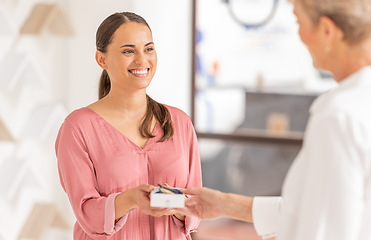 Image showing Happy customer, pharmacy or optician retail store for glasses, healthcare and eye care while buying glasses, medicine or product. Woman with smile while shopping and happy about service in a shop