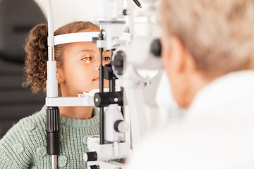 Image showing Child, kid or girl in optometry eye exam with optometrist, ophthalmologist or consulting medical profession and clinic slit lamp. Eye test, children eye care or vision check for healthcare insurance