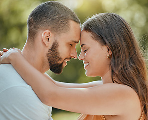 Image showing Couple, love and forehead touch in garden, summer park or outdoor backyard in Spain for care, happiness and easy lifestyle together. Smile, romance and date of man, woman and people in happy marriage