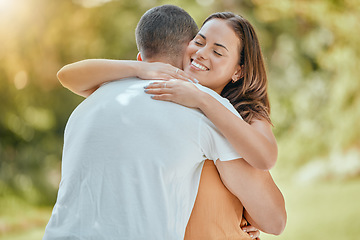 Image showing Hug, love and couple with support in a park, smile and happy on an outdoor date together in summer. Trust, happiness and man and woman hugging with affection, care and compassion in garden in nature