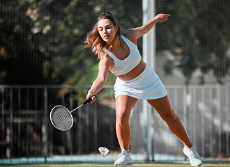 Image showing Badminton, sports and woman athlete with a racket ready to swing in outdoor sport game. Young female player doing cardio exercise, match training and a wellness workout on a fitness court for health