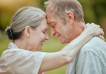 Image showing Elderly, couple and forehead touch with love, care and bonding in retirement, outdoor and nature. Senior man, woman and retired romance in park, garden or backyard for hug, happy or face together