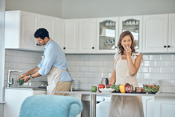 Image showing Health cooking, eating and couple in a kitchen with vegetables and salad for vitamins and wellness. Diet, nutrition and food recipe of a wife and man together making a healthy dinner meal at home