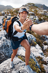 Image showing Woman get help hand on mountain hiking with partner, friends or coach for fitness, health and adventure. Girl hiker, helping hand and support on nature rocks outdoor for wellness, fun and exercise