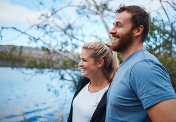 Image showing Couple, smile and lake in nature for camping, bonding and morning view with happiness outdoor. Man, woman and happy by calm water together on vacation, adventure or holiday for rest, relax and peace