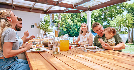 Image showing Family, lunch and outdoor happiness of a mother, man and children with grandparents and kid care. Happy big family, kids and parents together bonding with barbecue food in summer eating with a smile