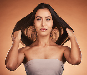 Image showing Beauty, hair and skin with woman in makeup portrait, natural cosmetic and hair care against orange studio background. Skincare, cosmetics treatment and hairstyle with wellness and keratin glow.