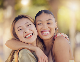 Image showing Asian, women friends and happy portrait in outdoor sunshine with embrace, hug and smile in summer. Happy diversity, best friends and happy with happiness in metro together on vacation in Jakarta