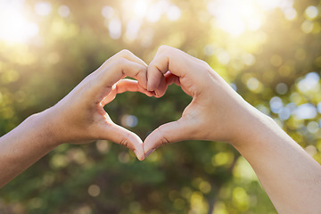 Image showing Heart, love and hands sign at a park, nature and trees bokeh sunshine for earth day, outdoor wellness and healthcare. Support, community and volunteer hand icon for clean green environment in summer