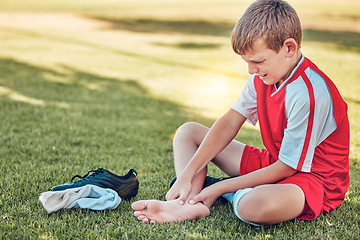 Image showing Soccer, injury and pain of child foot on field cry for medical emergency, healthcare insurance and wellness. Football, soccer field and sad kid crying with legs massage for sports training accident