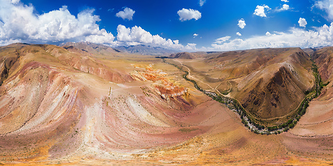 Image showing Aerial shot of the textured yellow nad red mountains resembling the surface of Mars