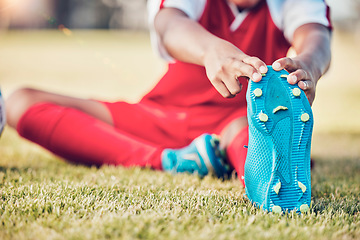 Image showing Stretching, foot and soccer player on field for sports training, exercise and legs muscle wellness health zoom. Football athlete with shoes or sneakers gear for warmup workout or game on grass pitch