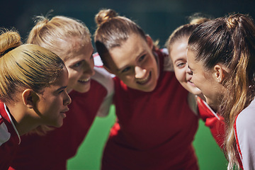 Image showing Women, football and team huddle on field at soccer game, motivation and team building for girl sports. Fitness, training and happy girls talk at soccer match in support of winning teamwork and goals.