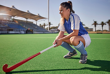 Image showing Sports, hockey and woman relax on field during match, thinking and planning a game strategy. Field hockey, coach and girl with stick, athletic and mindset at stadium for training, exercise and sport