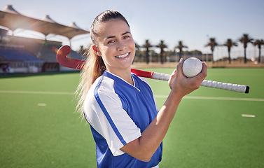 Image showing Sports, hockey and woman at a stadium for fitness, training and game practice, happy and proud. Field hockey, coach and sport leader portrait of lady holding a ball before endurance match on a field