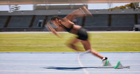 Image showing Fitness, run and fast blur athlete running on a race track for sports, athletics and exercise on the track. Workout, training and cardio jogging with sportswoman racing or sprinting outside