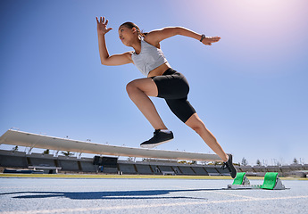 Image showing Woman runner, running and training on track, workout and exercise for race, marathon and sport in stadium. Speed, sports and fitness athlete with cardio, sprinter and run fast for competition