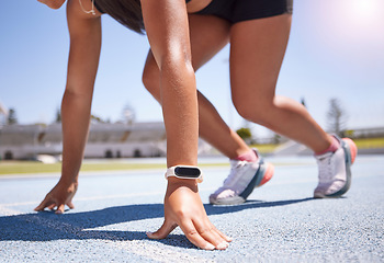 Image showing Hands, race and runner with a sports woman on track ready to start an endurance or cardio workout for competitive training. Smartwatch, fitness and exercise with a female athlete running for sport