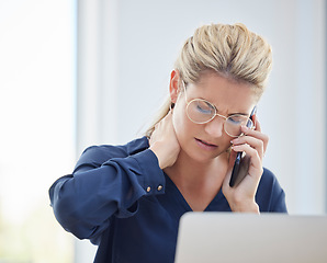 Image showing Phone call, neck pain and business woman with stress while working on a project with her laptop. Exhausted, stressed and professional employee on a mobile conversation with a smartphone in the office