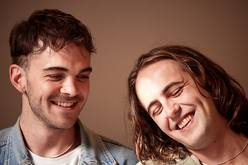 Image showing Love, happy and gay with a normal couple in studio on a brown background for lgbt inclusion or romance. Smile, relationship and homosexual with a young man and his partner bonding together inside