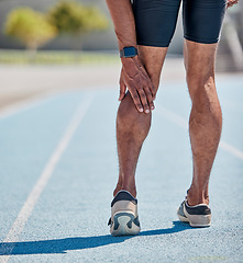 Image showing Legs injury for man running on track for cardio workout, sprint competition or marathon race. Muscle pain, calf problem and athlete runner with medical emergency while training for fitness workout