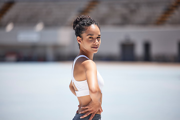 Image showing Woman portrait, athlete and fitness in an outdoor stadium happy about exercise, training and run. Black woman sports runner with a smile with happiness of health workout and sport goals outdoor