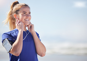 Image showing Earphones, runner and woman in nature with phone streaming audio, music or podcast mock up. Sports, fitness and female from Canada listening to song, radio or workout track after running or training