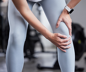 Image showing Hand, leg pain and woman at the gym in fitness fail, muscle training mistake or joint discomfort. Sports woman, knee pain and girl suffering from arthritis, inflammation or bruise during workout