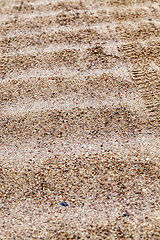 Image showing car tire tracks on a sandy road