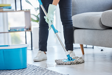 Image showing Mop, flooring and woman cleaning living room house, home and apartment. Cleaner, maid and housekeeping service on wet ground, care and safety of virus, bacteria and dust for household disinfection