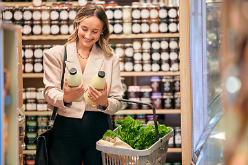 Image showing Woman, shopping and organic milk for diet, health or nutrition in store, supermarket or grocery shop. Happy, vegan girl and sale of product in retail, discount or promotion sales for wellness food