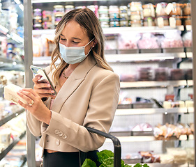 Image showing Grocery store, woman covid mask and phone food ingredient check of a retail customer. Groceries shop of a person looking at a mobile app for a healthy diet label shopping in a supermarket checking