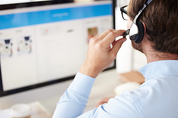 Image showing Man, call center and headset for phone call, talking with clients and telemarketing in office at desk. Young male, agent or working with digital device, computer and for customer service and support