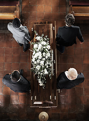 Image showing Funeral, family coffin and church above for death, grief or burial service with solidarity. Group, pallbearers and people together with casket for respect, farewell or sad in mourning, mass or loss