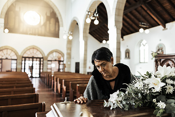 Image showing Widow, coffin and sad at a funeral feeling depression from death sitting in a church. Depressed Indian woman with mourning, grief and mental health problem at an emotional religion burial event