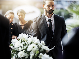 Image showing Death, funeral and carry coffin with family mourning, sad and depressed for grieving time. Grief together, mental health and man holding casket for church service, memorial and difficult for loss.
