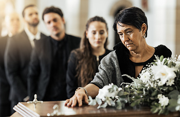 Image showing Funeral, death and coffin in church or Christian family gathering together for support. Religion, sad people and mourning loss or religious catholic men and women grief in church service over casket