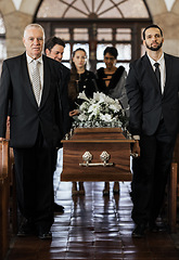 Image showing Funeral, church and family carry coffin for death, grief or sermon for burial with support. People, pallbearers and sad together with casket for respect, farewell or sorrow in mourning, mass or loss