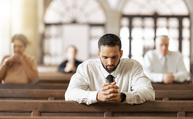 Image showing Church, prayer and man praying to God, worship or religion in cathedral. Faith, spiritual and christian community in chapel or sanctuary worshipping Jesus, holy praise or trust and hope in Christ.