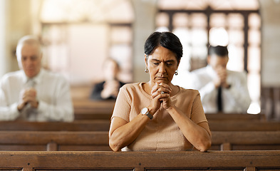 Image showing Faith, woman and praying in church, religion and spiritual connect, communication or believe. Senior female, mature lady or prayer in chapel with congregation, worship or trust with gratitude or hope