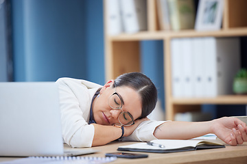 Image showing Burnout, sleeping and tired business woman in office after working overtime or overwork. Rest, relax and exhausted sleepy female employee taking nap by table after all night work on project deadline