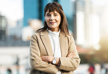 Image showing Senior business woman, portrait and arms crossed in city with smile. Vision, leadership and success mindset of mature female ceo, manager or company leader happy with goals, targets or career growth