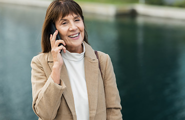 Image showing Happy, senior woman and phone call for conversation, discussion and with smile outdoor. Retirement, mature female and confident lady with smartphone for talking, communication and speaking to connect