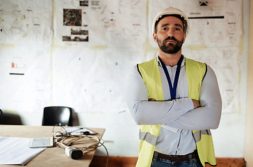Image showing Construction worker, portrait and man with arms crossed in office or building site for architecture project. Architect, engineer or serious male contractor, leader or engineering manager at workplace