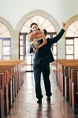 Image showing Celebration, carrying and man with bride after wedding in a church, happy and smile for marriage event. Love, comic and couple walking in a building after getting married to celebrate together