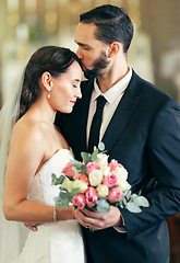 Image showing Wedding, couple and forehead kiss with love while holding a bouquet of flowers for marriage, walking down the isle and marry. Bride, groom and newlywed people happy together after a celebration event