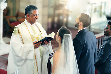 Image showing Wedding, couple and priest with a bible in church praying to God with a Christian pastor reading the holy book. Love, bride and groom say an oath for a faithful and spiritual marriage commitment